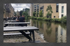 Lancaster Canal and outdoor picnic tables at The White Cross pub
