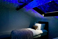 Top floor sensory bedroom at The Joseph Cosy with blackout blind and galaxy projector