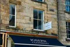 Exterior of The Joseph Cosy above Joseph Clothing in a historic sandstone building in Lancaster