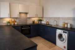 Fully equipped open-plan kitchen at The Joseph Cosy
