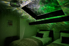 Cosy top floor sensory bedroom at The Joseph Cosy with blackout blind and sensory projector lighting