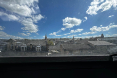 View through the Velux window in the sensory bedroom at The Joseph Cosy overlooking the Lancaster skyline and Ashton Memorial