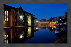 Lancaster Canal at night near The Water Witch with reflections on the water