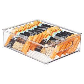 A transparent plastic fridge organizer with compartments, perfect for stacking and storing various food items.