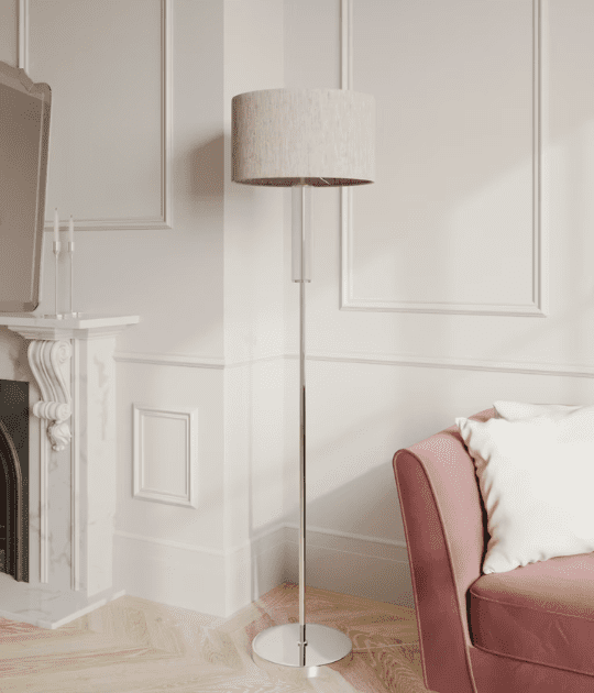 Tall Monroe floor lamp with a neutral fabric shade in a chic living room.