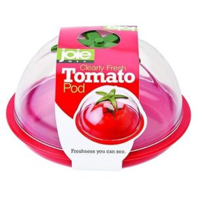 A red plastic tomato-shaped storage pod with a clear lid, designed to keep cut tomatoes fresh.