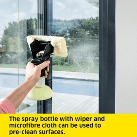 Kärcher WV 5 Plus N Window Vac – A handheld window vacuum cleaner being used to wipe a glass surface with a microfiber cloth attachment.