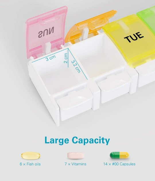 The pill organizer opened, revealing its large-capacity compartments with labels for AM and PM.