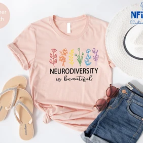 Three different t-shirts in soft pink, black, and maroon, each featuring a 