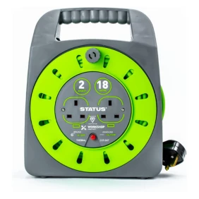 A portable gray and green retractable cable reel with a built-in power socket and handle.